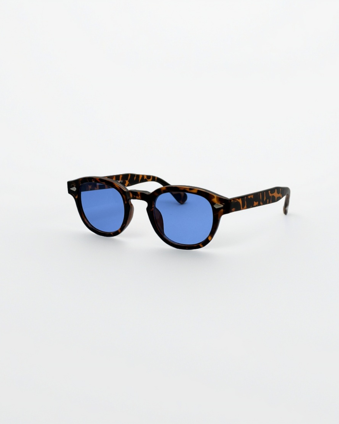 Close-up product view of harbor tortoise blue sunglasses by Alga, showing the frame and lenses.