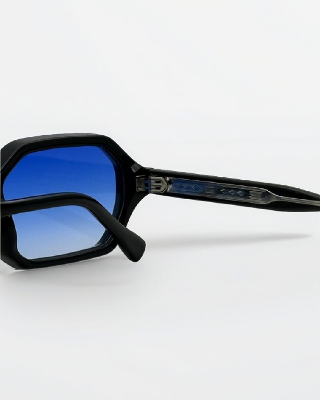 Portrait of a person wearing pier black blue gradient sunglasses by Alga.