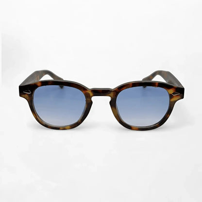 Aqua Tortoise sunglasses featuring a natural tortoise frame and gradient blue lenses, perfect blend of retro and contemporary style.