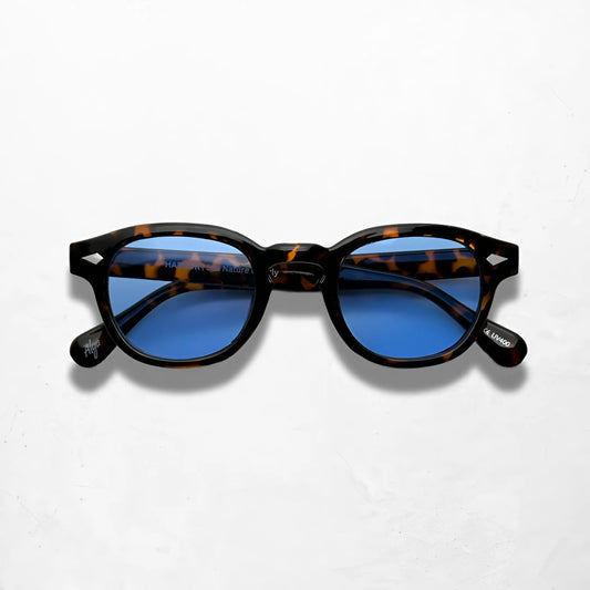 Deep Tortoise sunglasses with gradient blue lenses, featuring a stylish dark tortoise frame and glossy finish.
